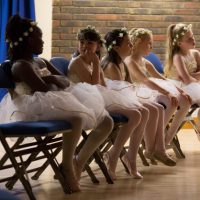 2 Cropped bridesmaids on chairs